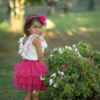 dettaglio pagliaccetto con fiocco bambina
