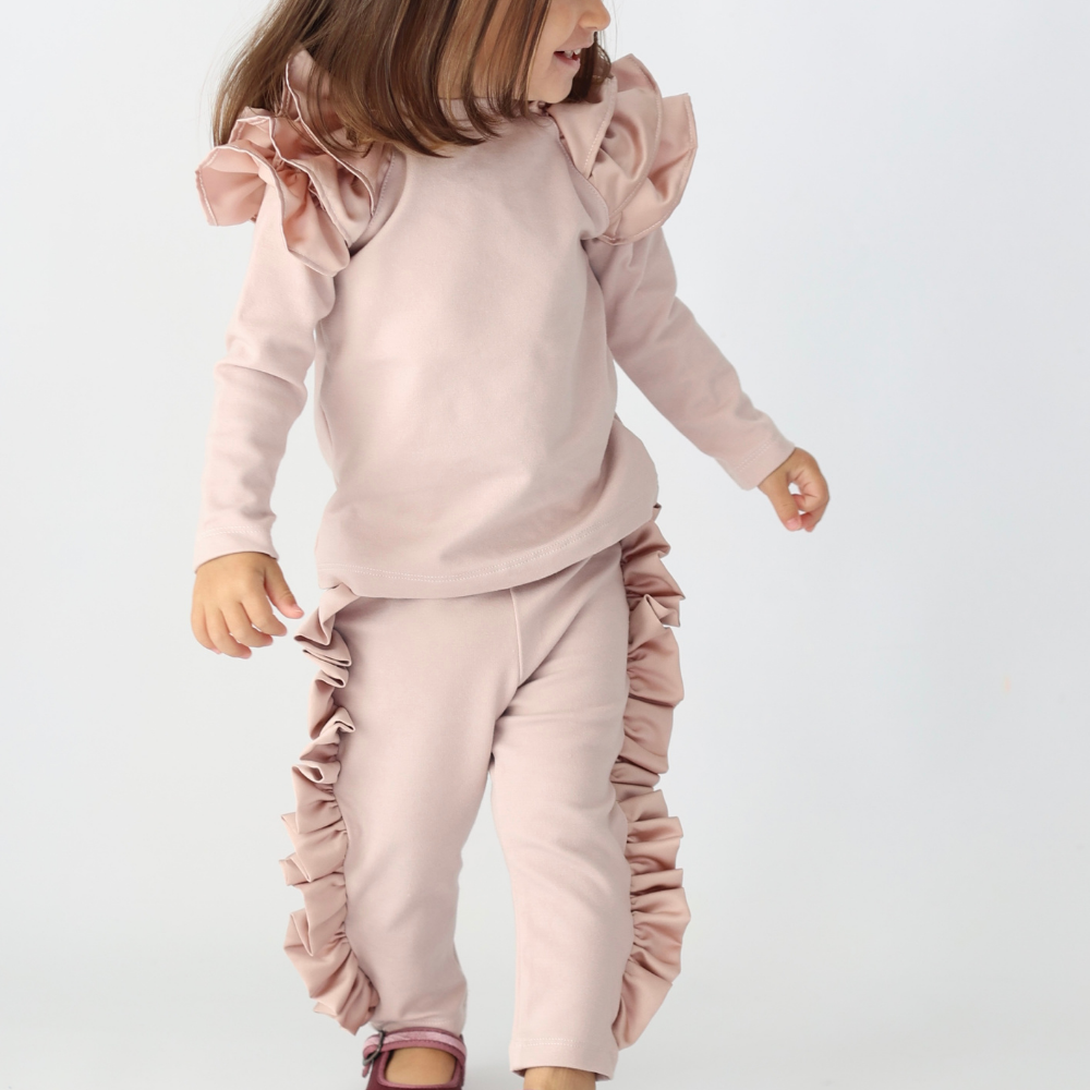 pantalone rosa cipria da bambina con dettagli voluminosi laterali